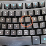 keyboard key with letter rubbed off