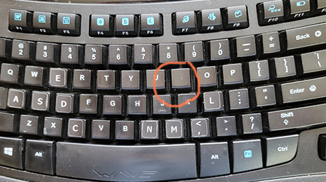 keyboard key with letter rubbed off